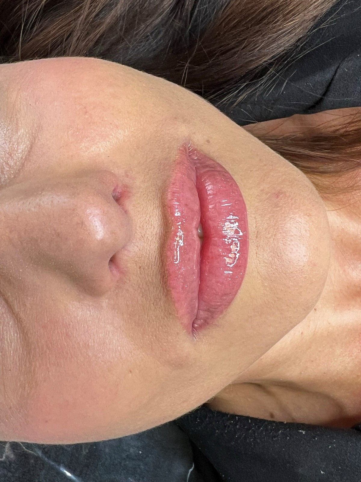 Glossy healed lip blush result by Erika Davis Aesthetics
