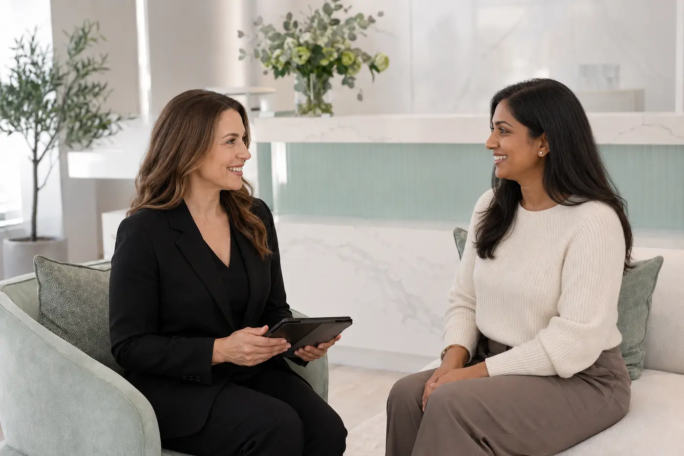 Professional treatment booking consultation at Erika Davis Aesthetics